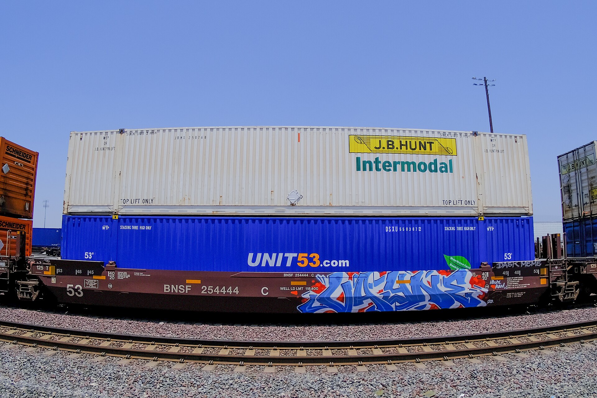 Intermodal containers stacked on railcars at an intermodal terminal