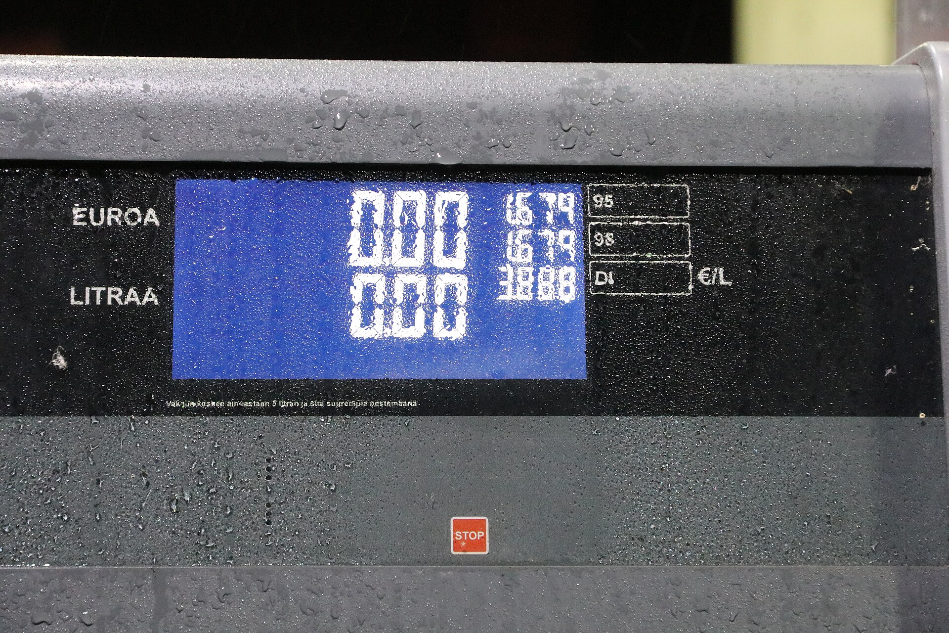 Diesel fuel pump nozzle at truck stop with price display showing elevated per-gallon cost