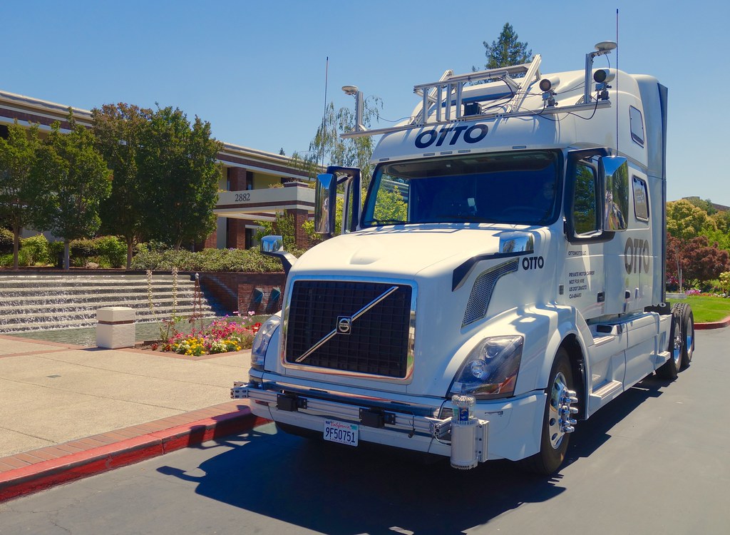 Knight-Swift Transportation Holdings semi-truck on highway, representing truckload carrier rate negotiations and capacity tightening in freight market