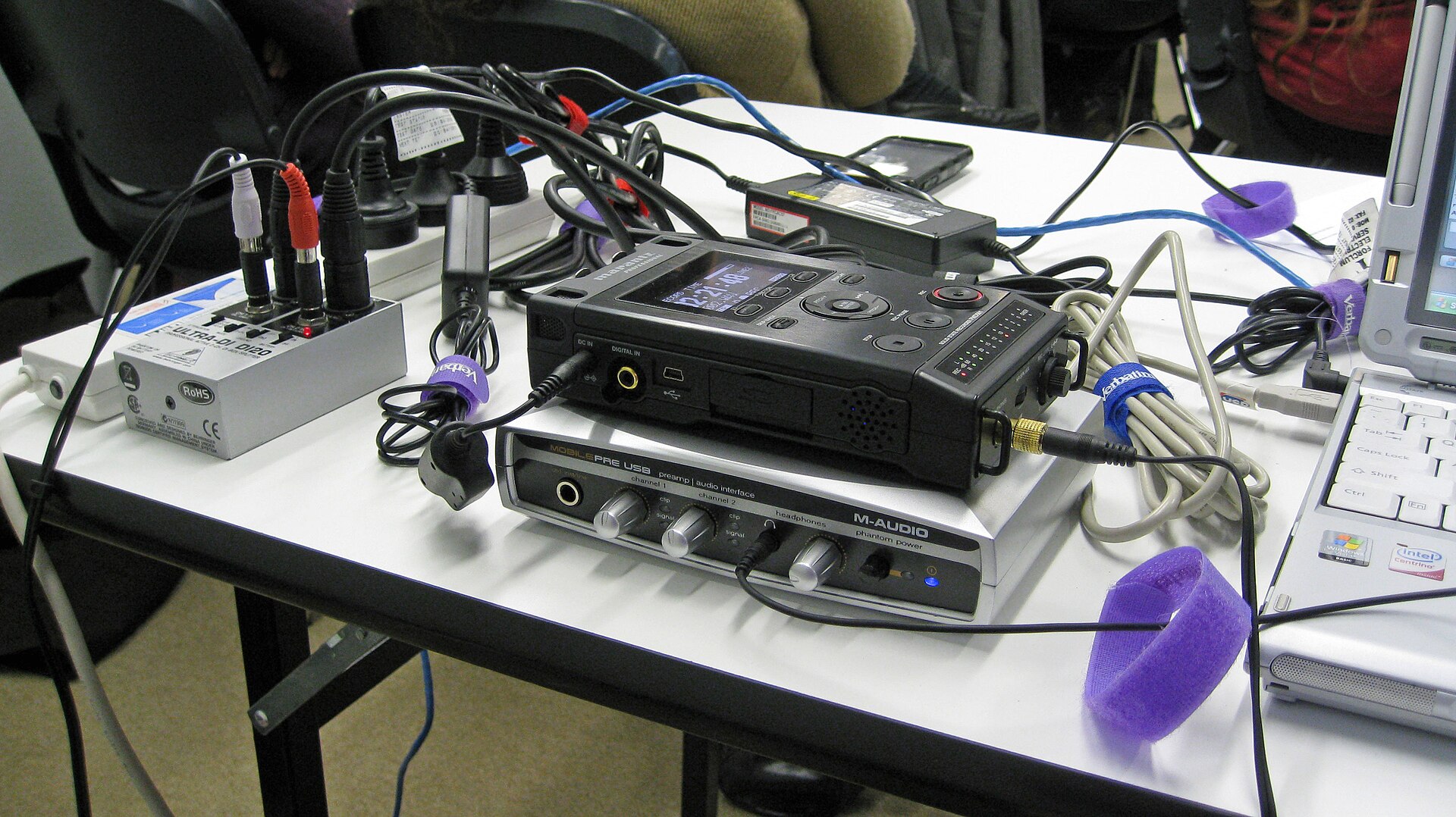 Podcast microphone and recording equipment in studio setting