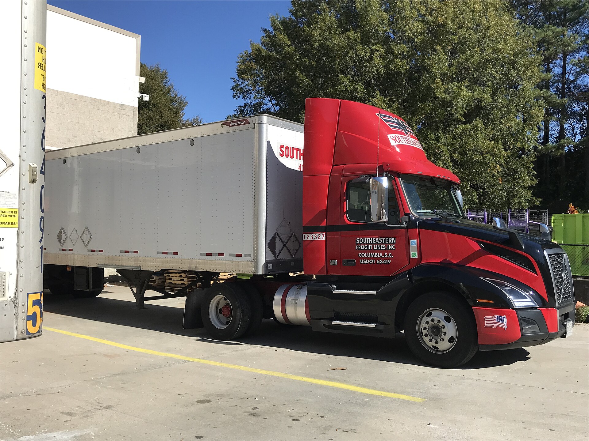 Freight truck on highway representing capacity tightening and rising spot rates in 2026 trucking market