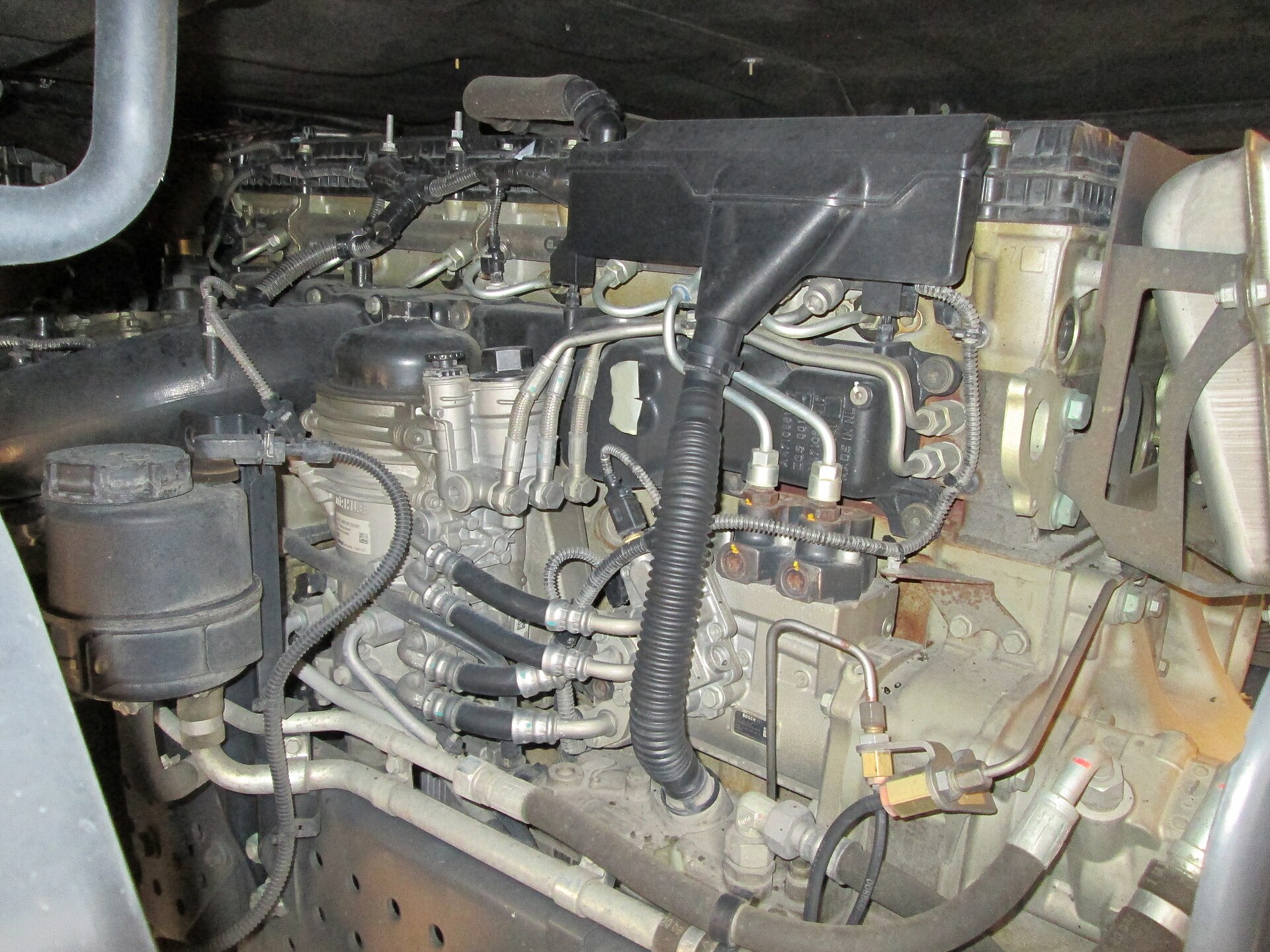 International Motors Class 8 diesel engine in chassis bay showing oil filter and service access points