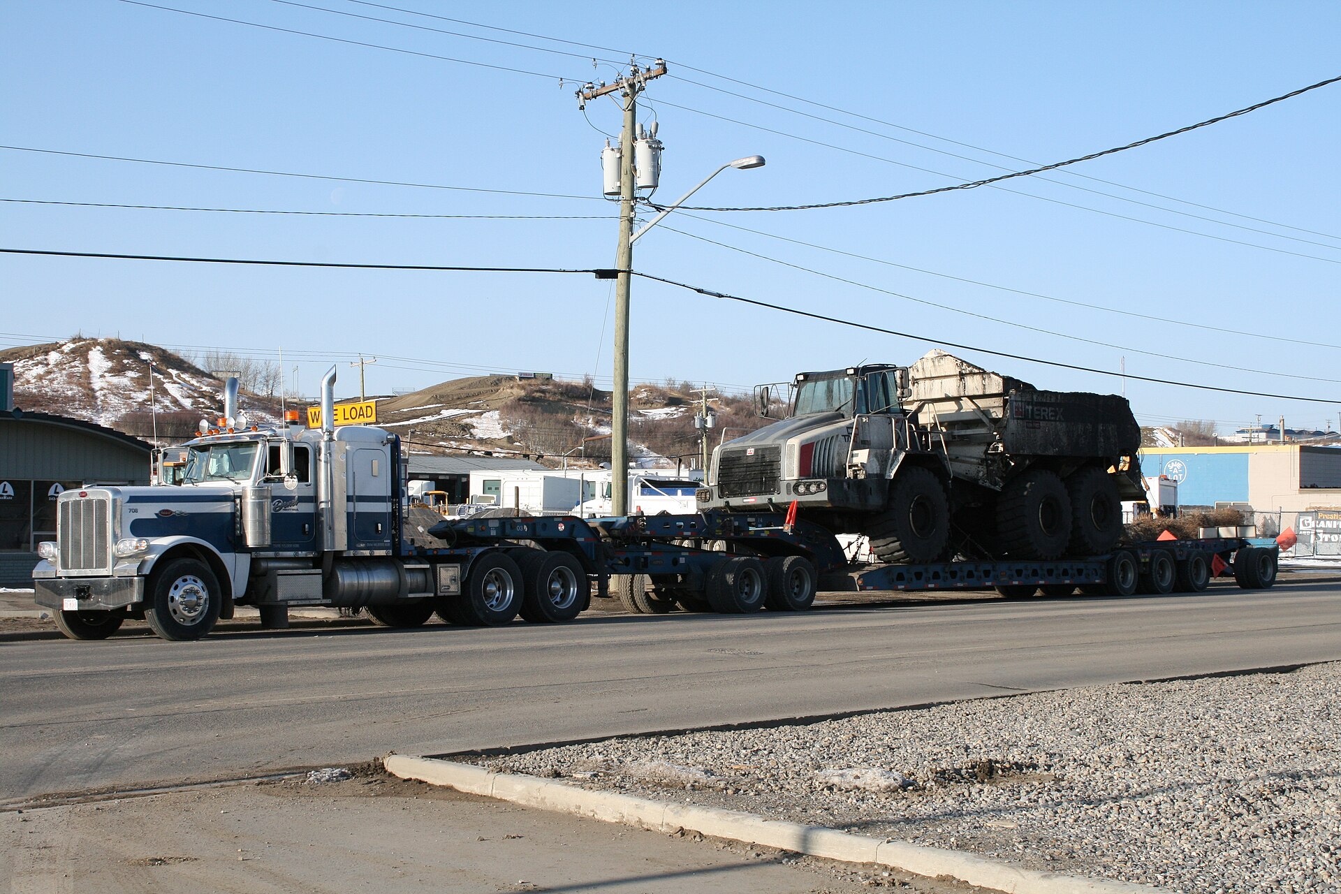 Freight trucks on highway representing spot rate increases across dry van, reefer, and flatbed equipment types