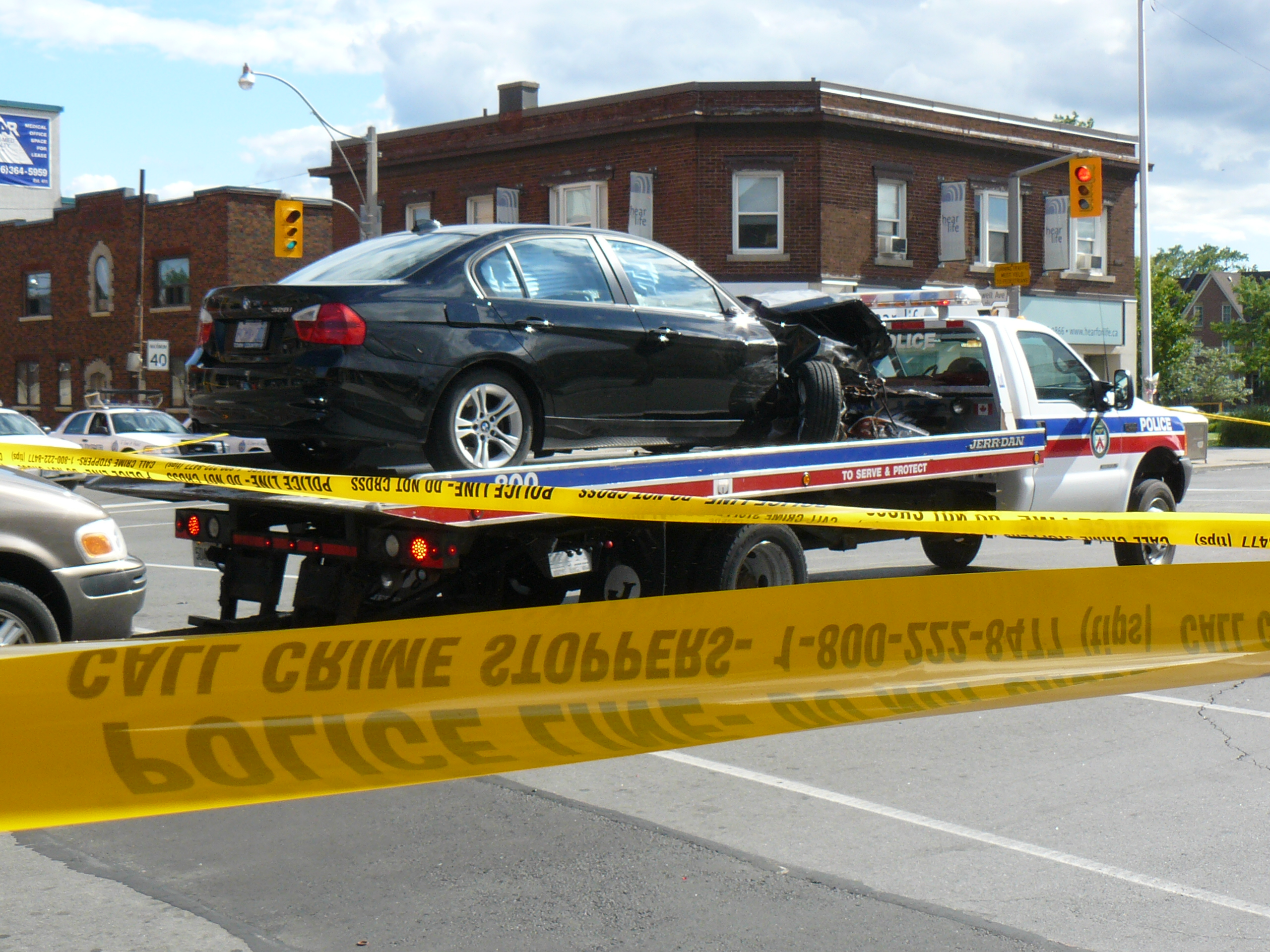 Freightliner semi-truck involved in multi-vehicle crash at urban intersection