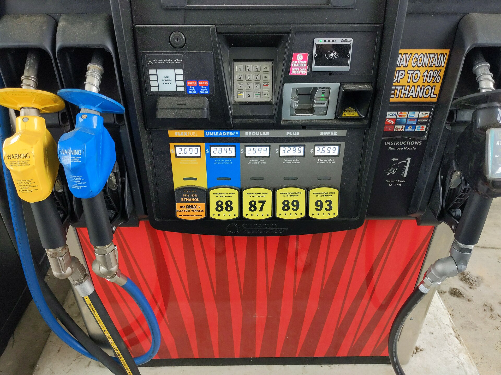 Diesel fuel pump nozzle at truck stop showing price per gallon on digital display