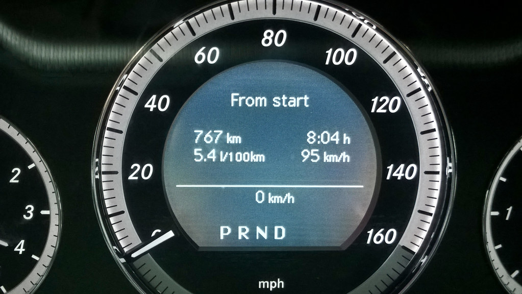 Class 8 tractor with aerodynamic fairings and fuel-saving equipment on highway