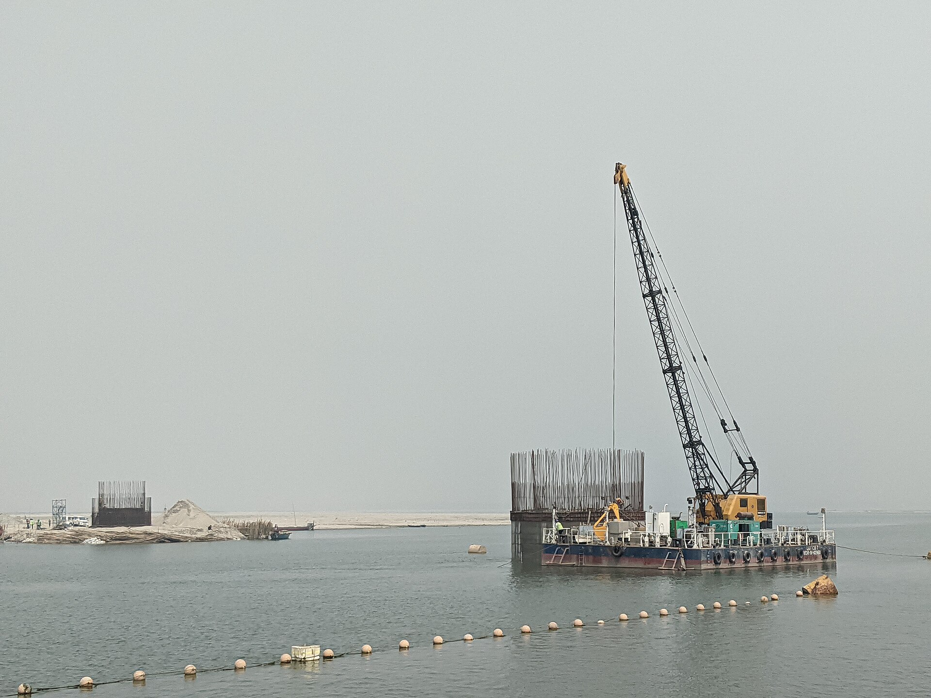 Interstate 10 bridge crossing Mobile Bay in Alabama, showing truck traffic on aging span