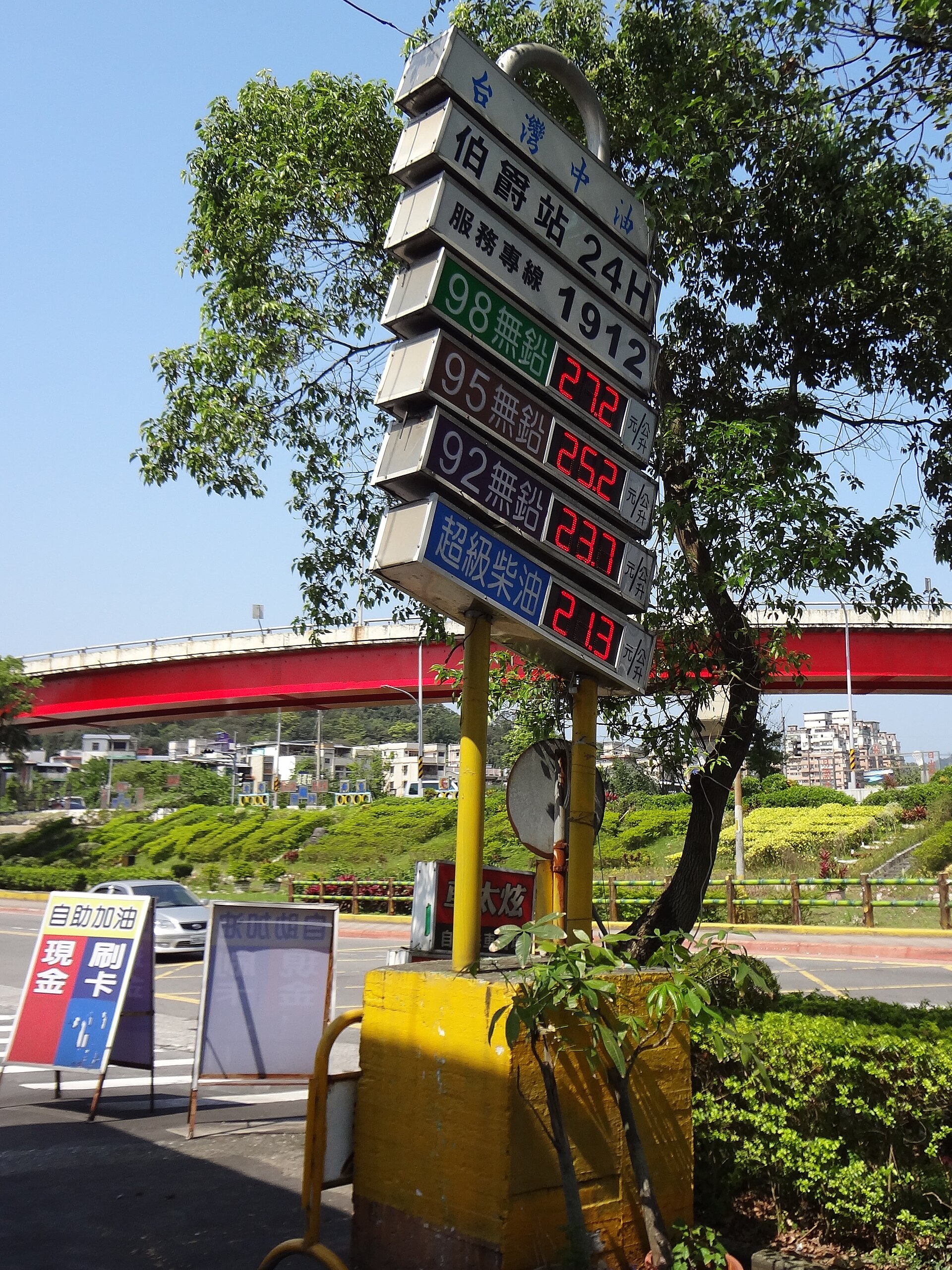 Diesel fuel pump nozzle at truck stop with price display showing elevated fuel costs