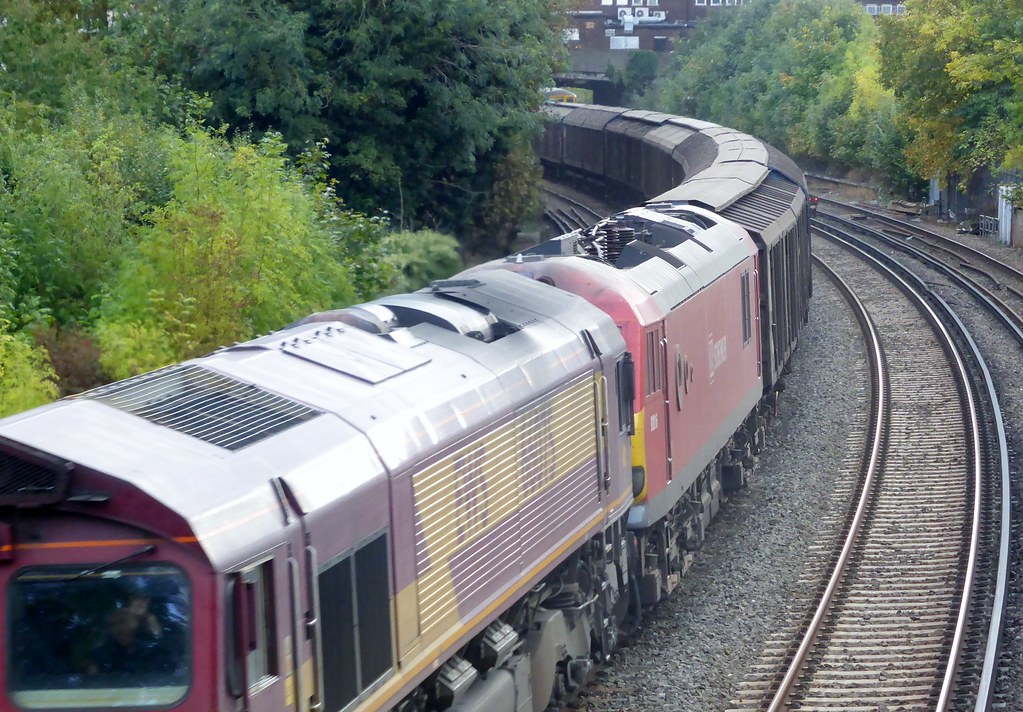 Warehouse interior with stacked pallets and forklifts, representing contract logistics and third-party warehouse operations