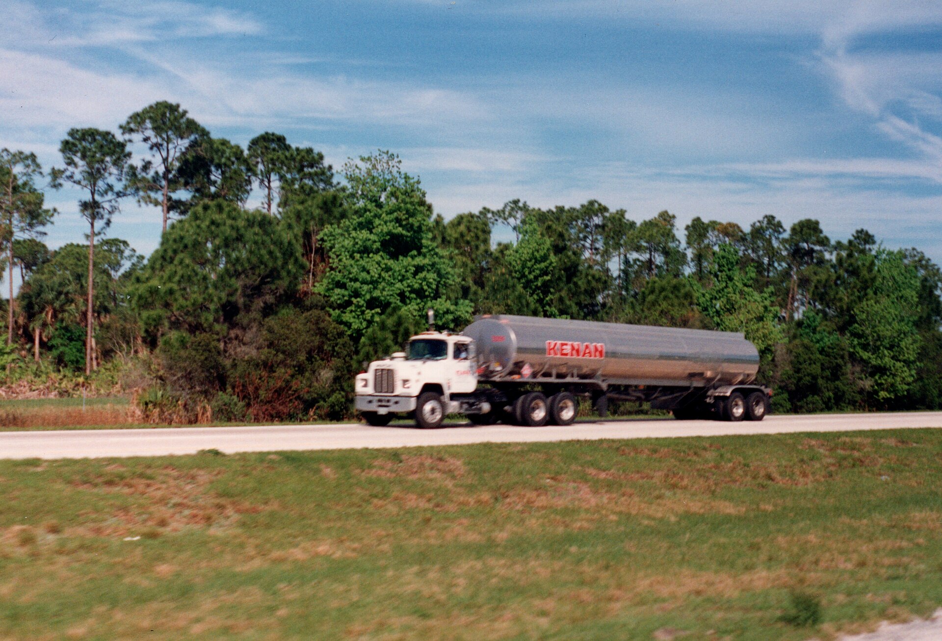 Freight trucks lined up at a distribution center loading dock during peak shipping hours