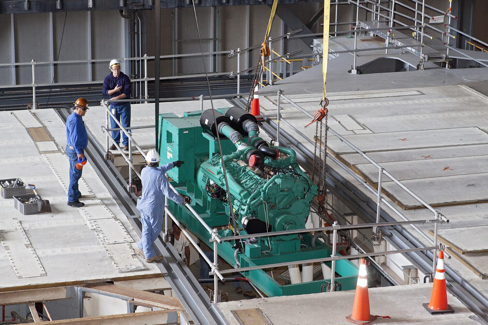 Fleet manager reviewing equipment upgrade options in maintenance shop