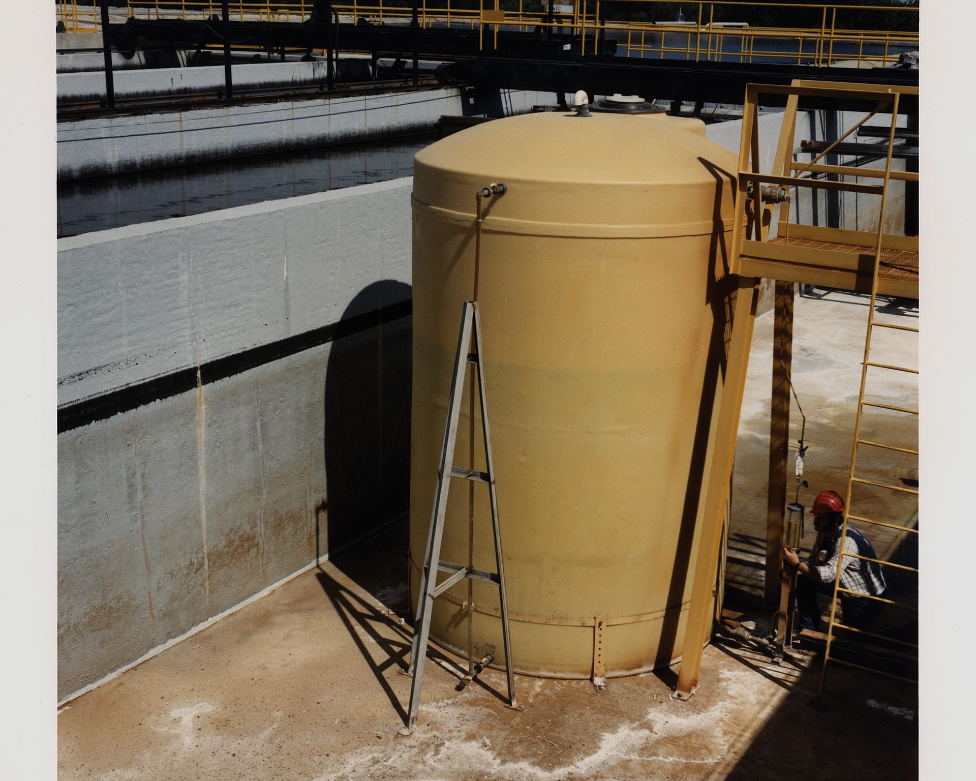 Large cylindrical oil storage tanks at Cushing, Oklahoma terminal under clear sky