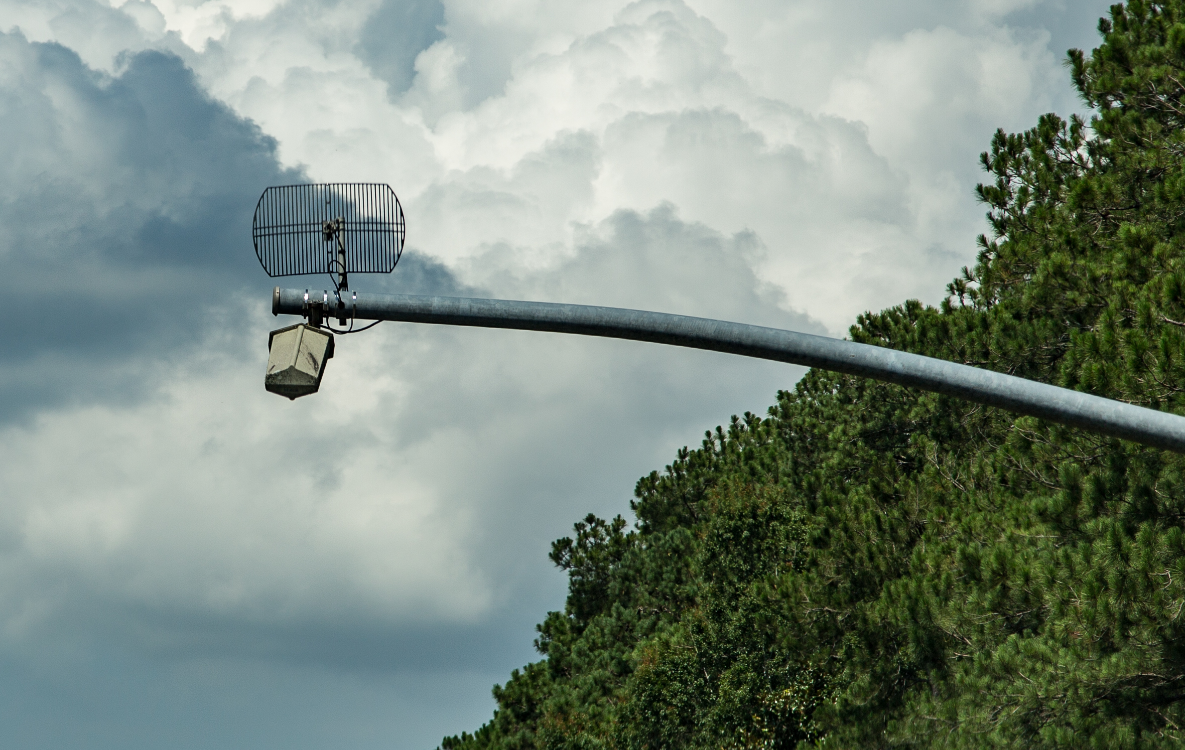 Commercial truck passing weigh station with PrePass transponder mounted on windshield