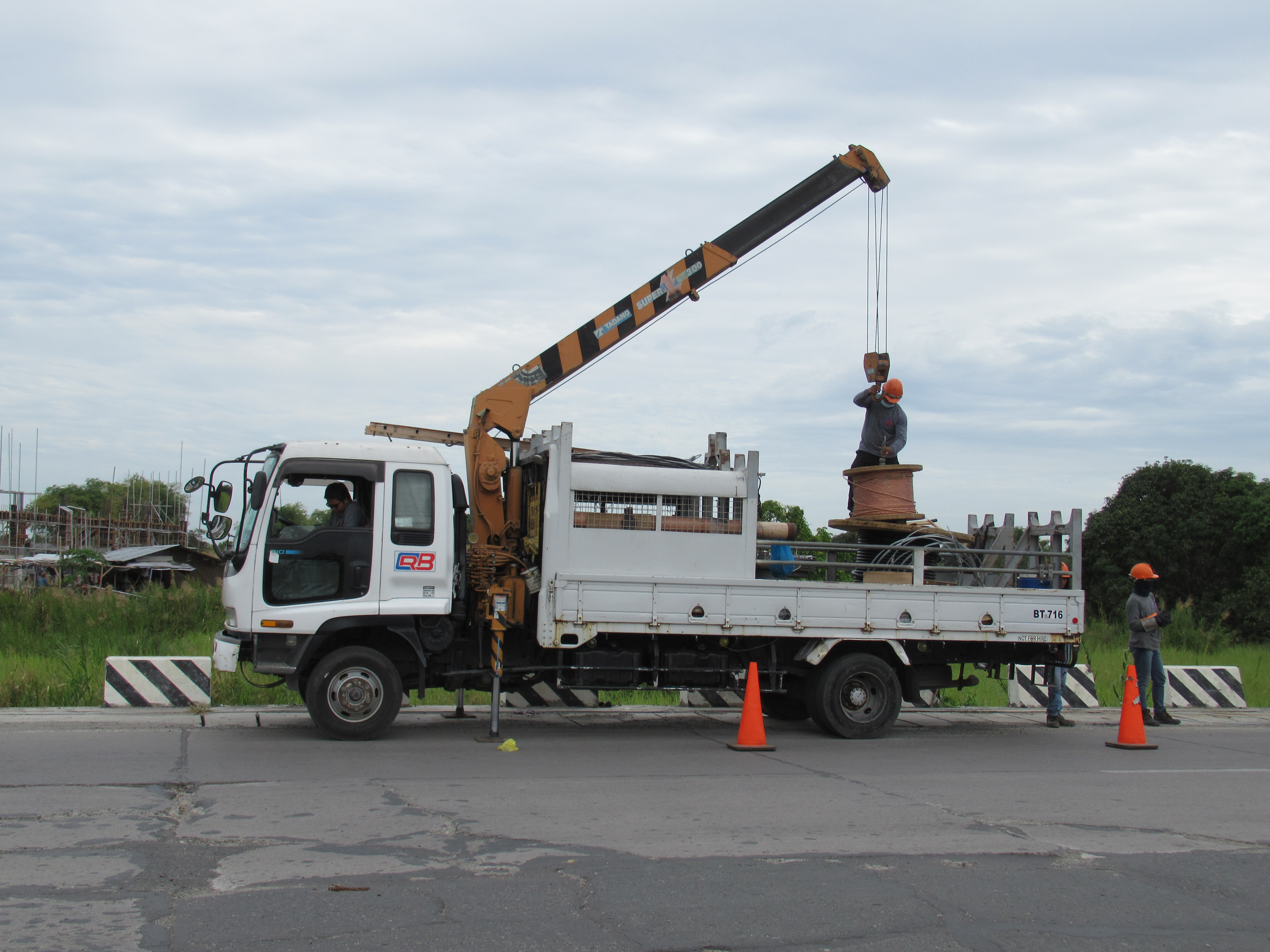 Electric truck charging station with multiple heavy-duty chargers at fleet terminal