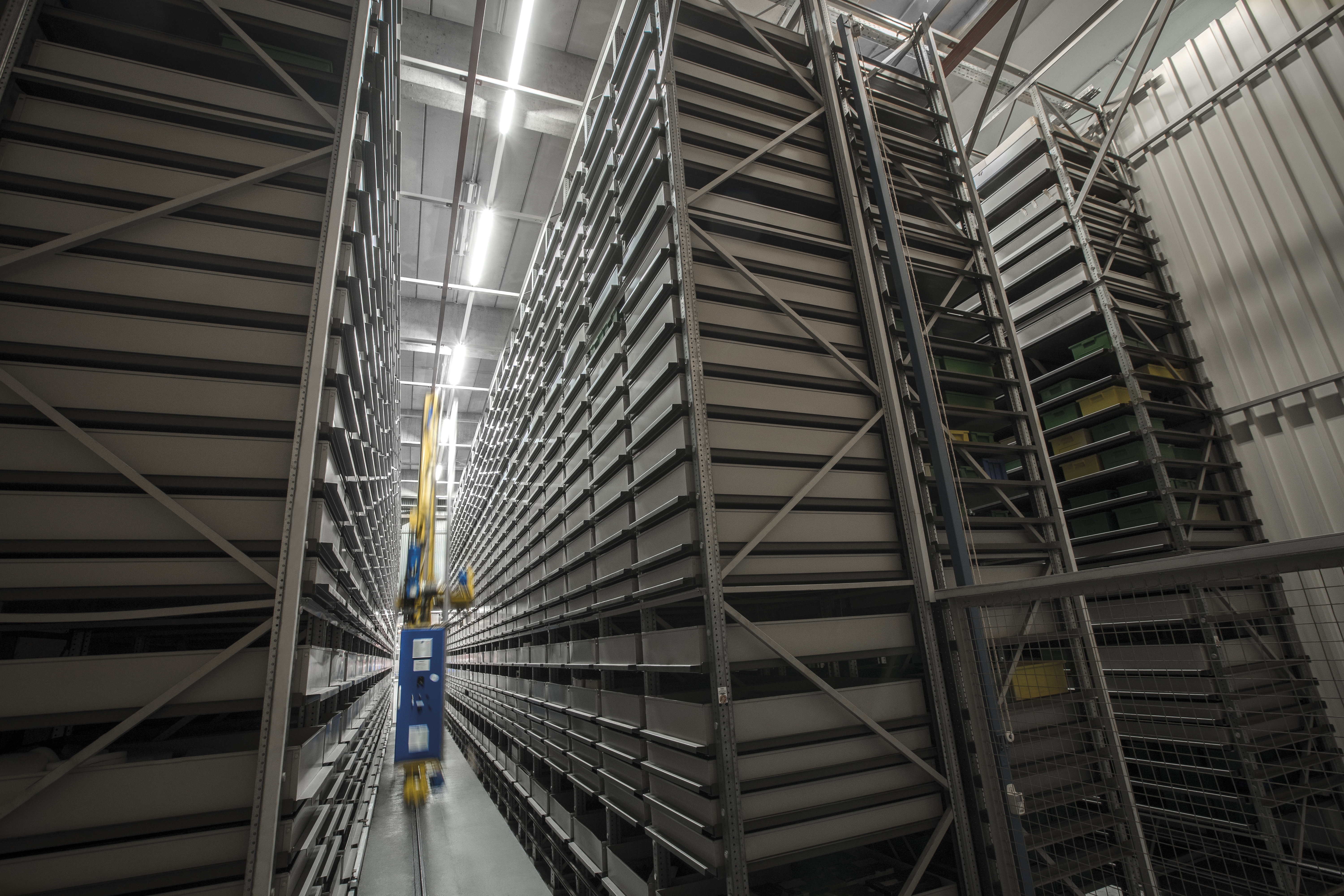Warehouse worker scanning inventory with handheld device in distribution center