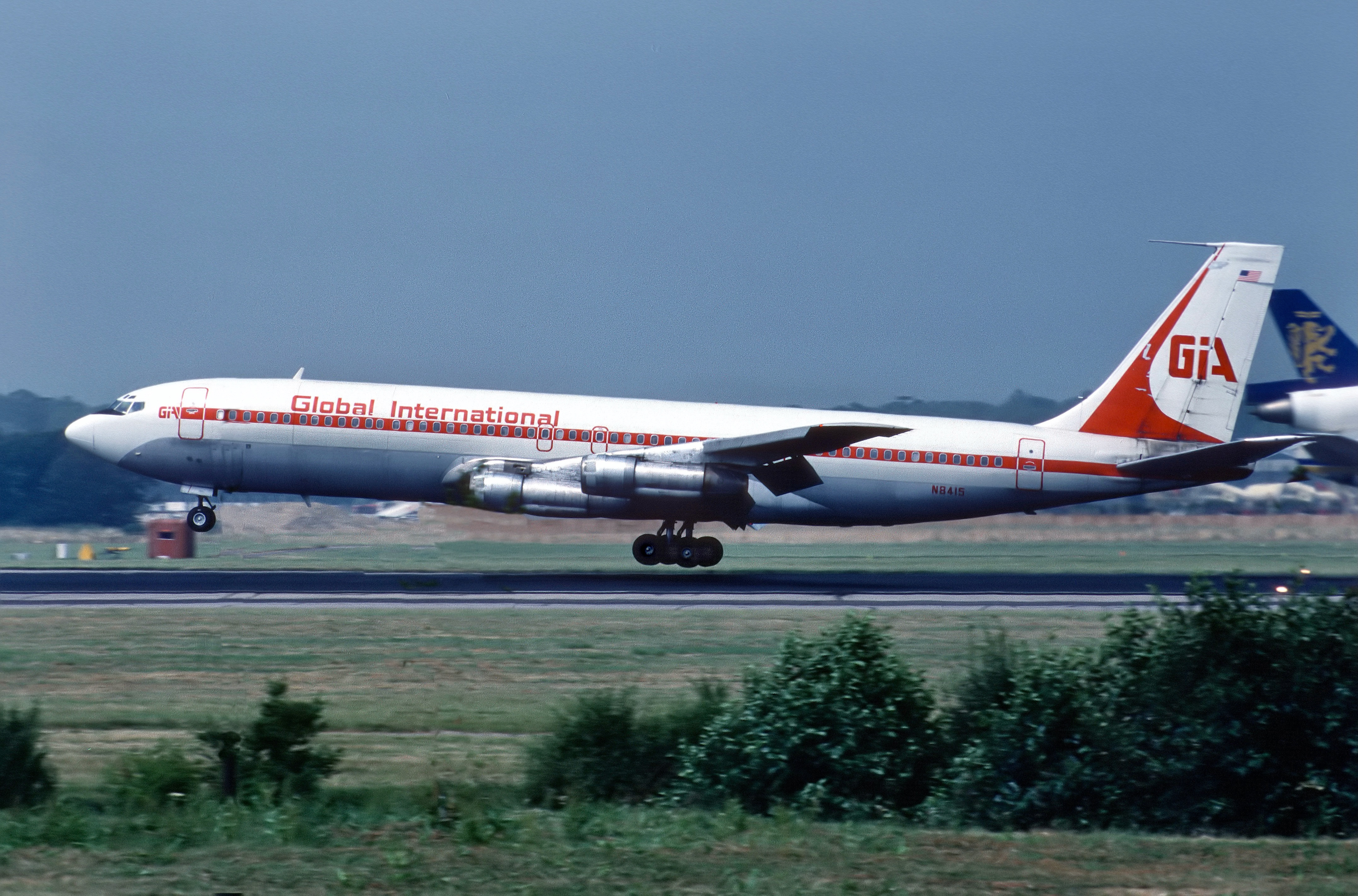 Empty warehouse floor with loading docks and industrial shelving after facility closure