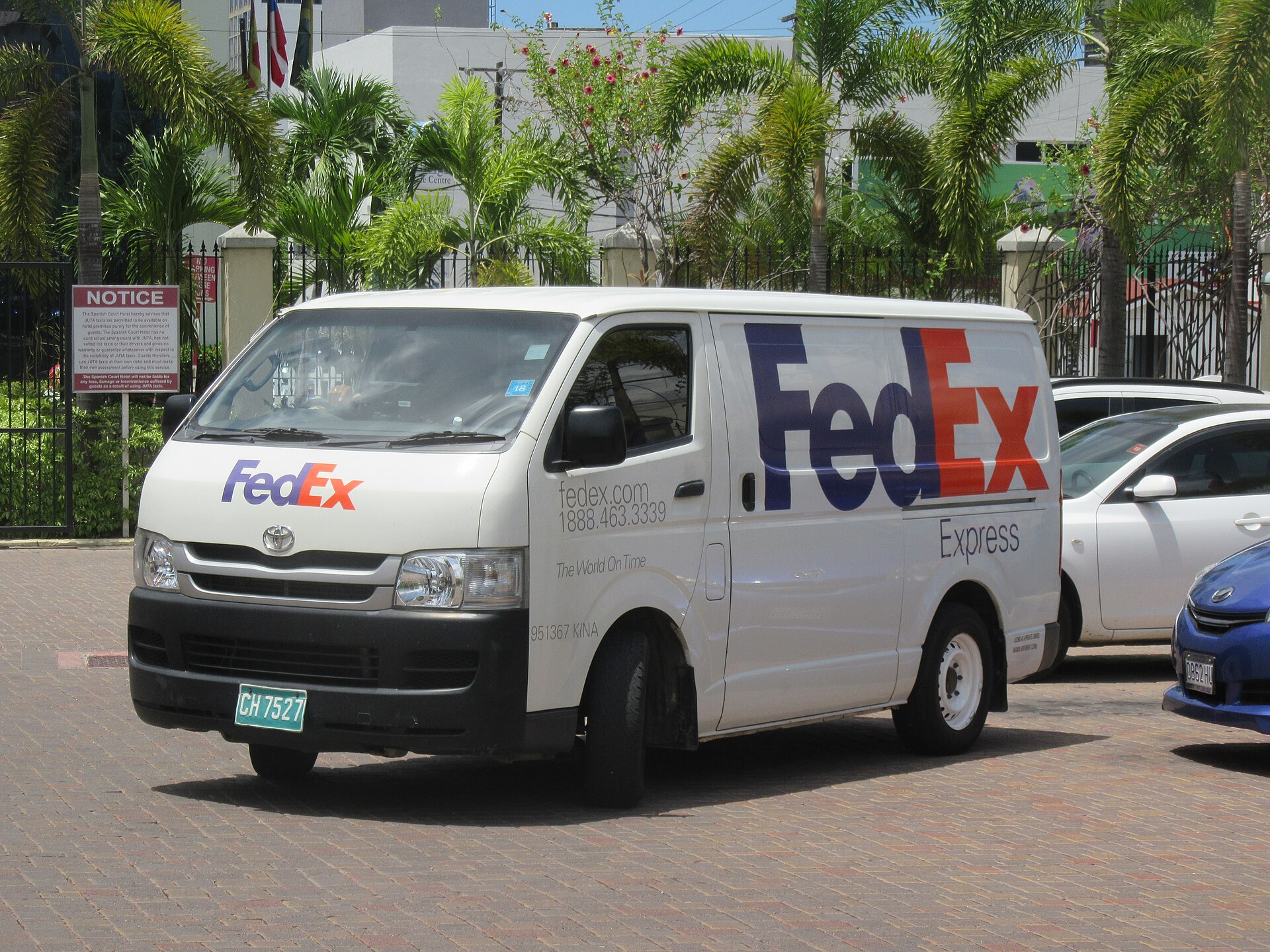 Harbinger electric medium-duty truck in FedEx pickup and delivery livery