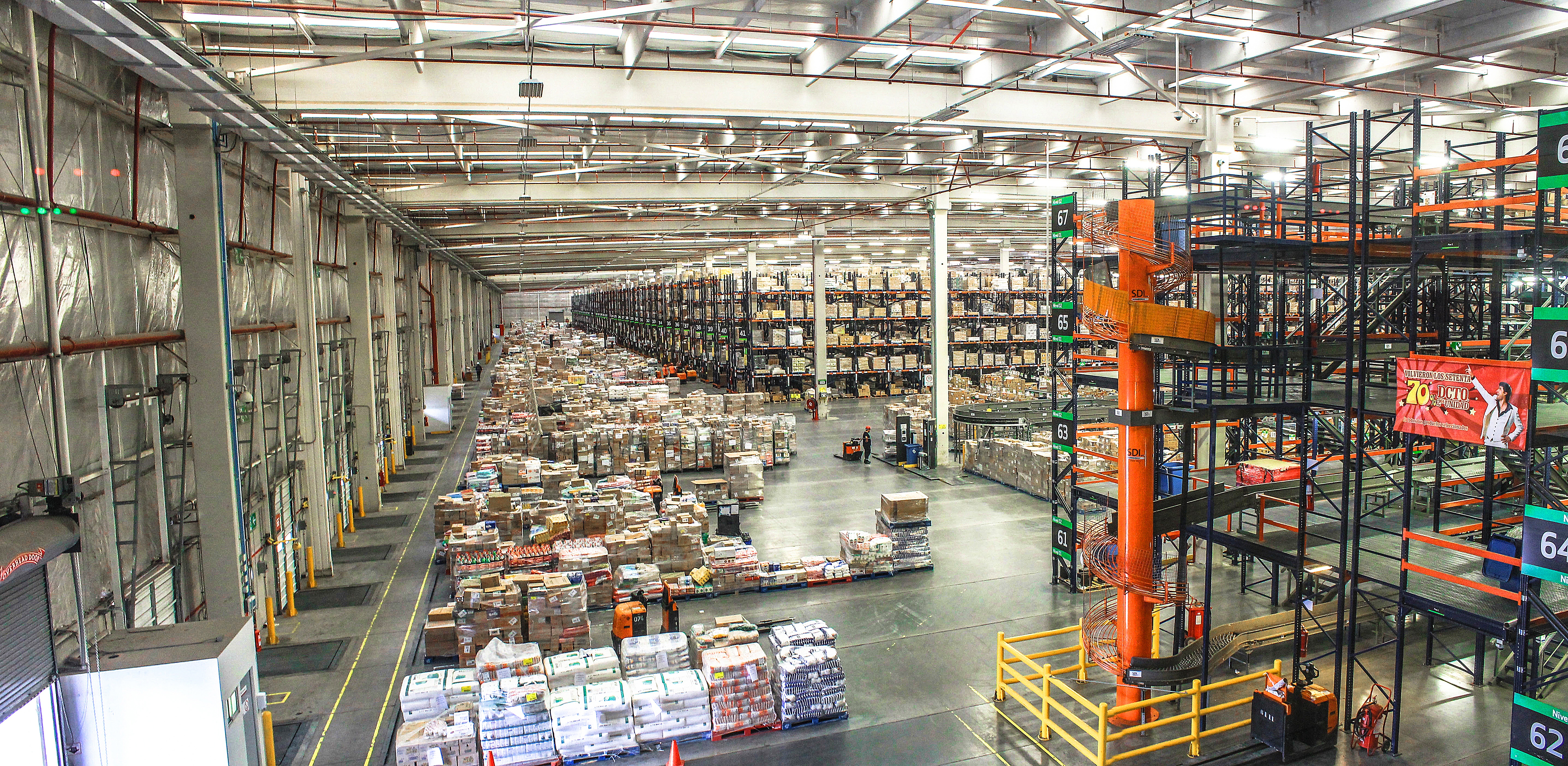 Saia LTL terminal with multiple dock doors and trailers backed into loading bays
