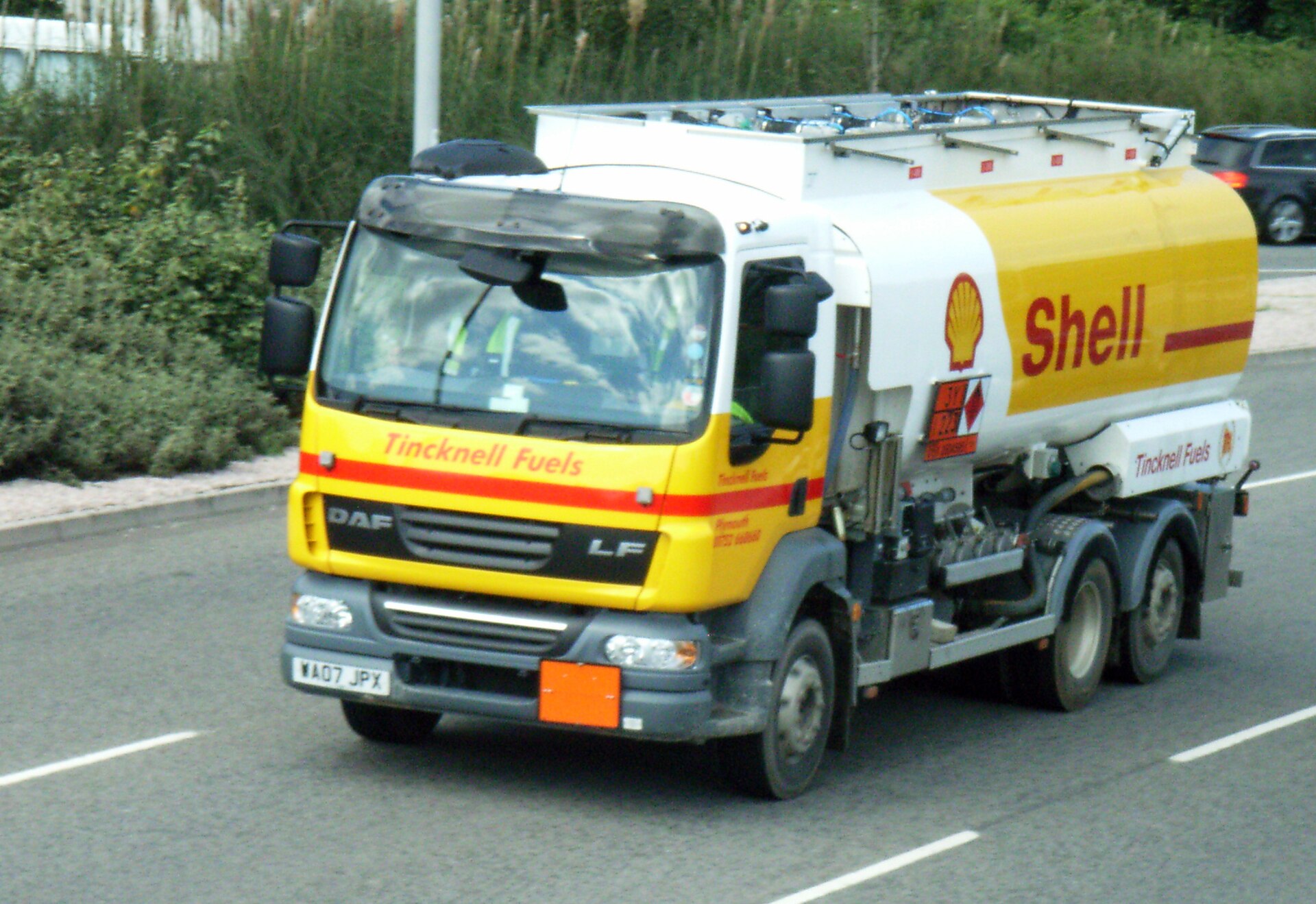 Petroleum tanker truck hauling liquid fuel on highway