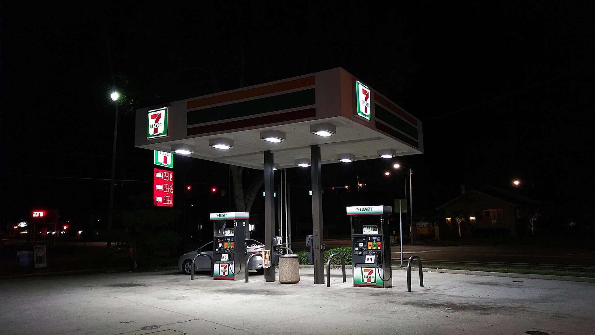 Fuel pump nozzle at truck stop with digital price display showing diesel cost per gallon