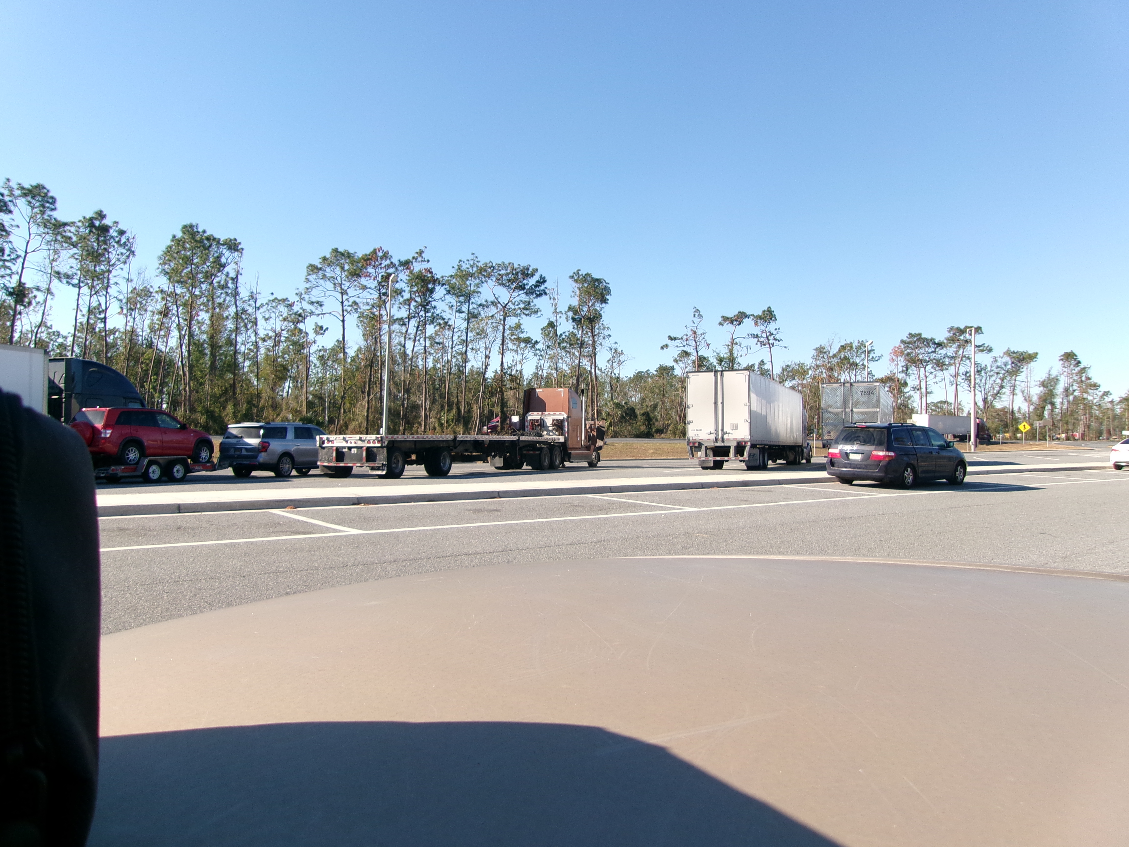 Empty truck parking lot at dusk with space for dozens of tractor-trailers