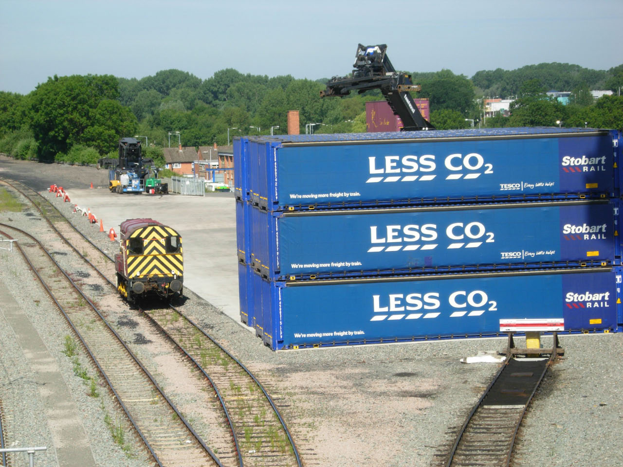 Intermodal containers stacked on a rail flatcar at a freight terminal