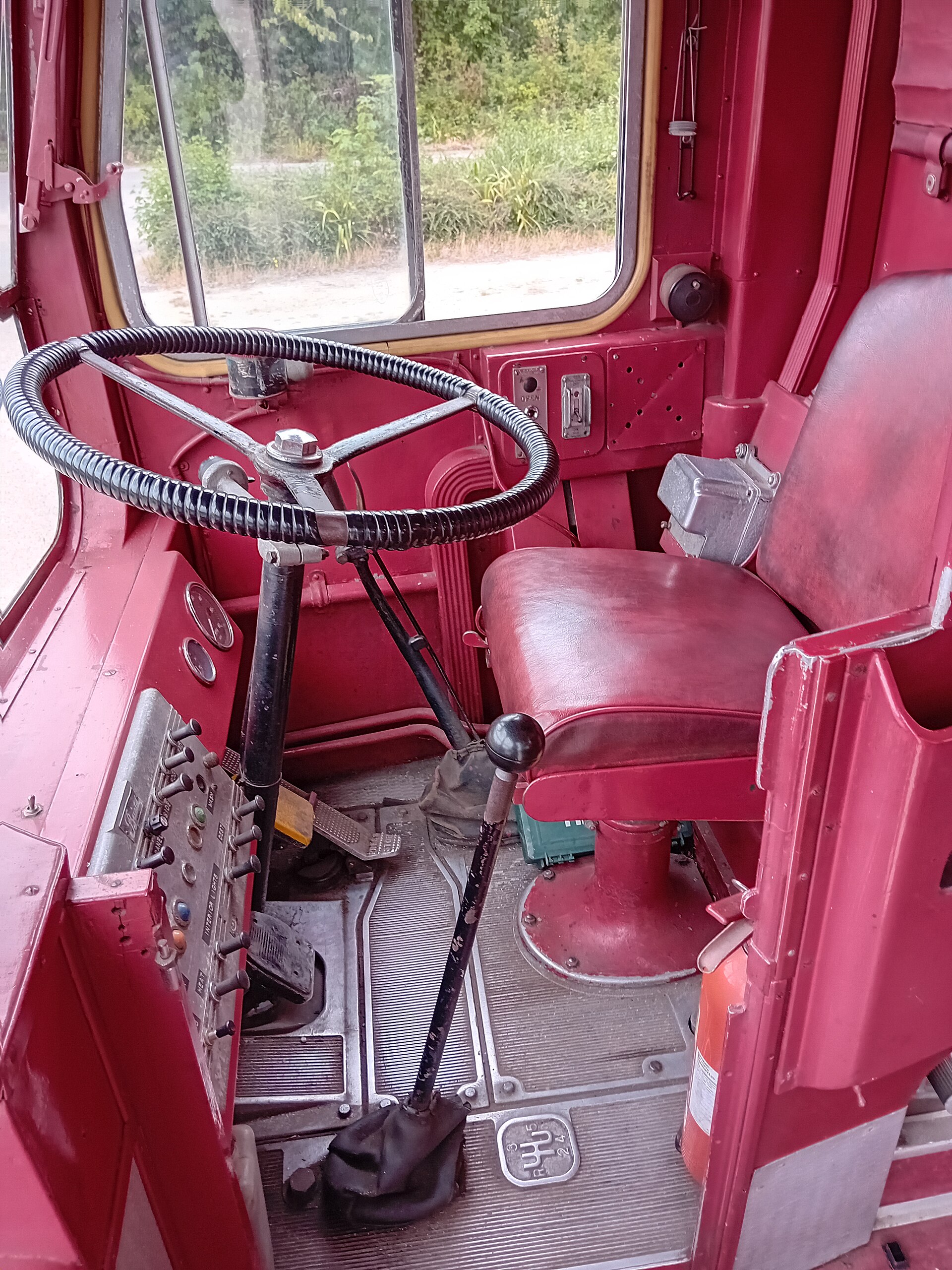 Class 8 truck cab interior showing mounted camera and telematics hardware used for driver safety monitoring