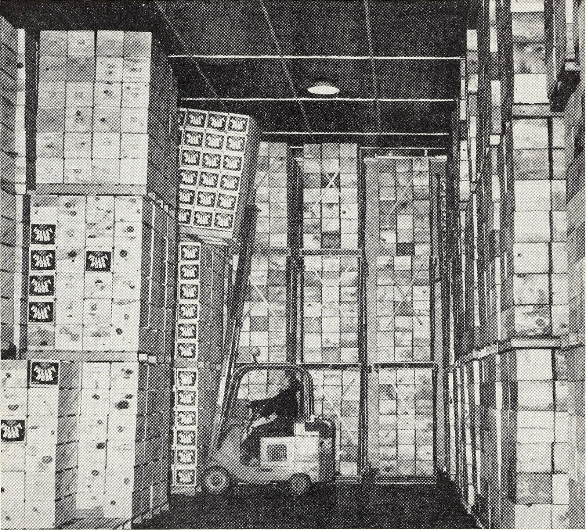 Urban warehouse loading dock with box trucks and cargo vans in tight formation