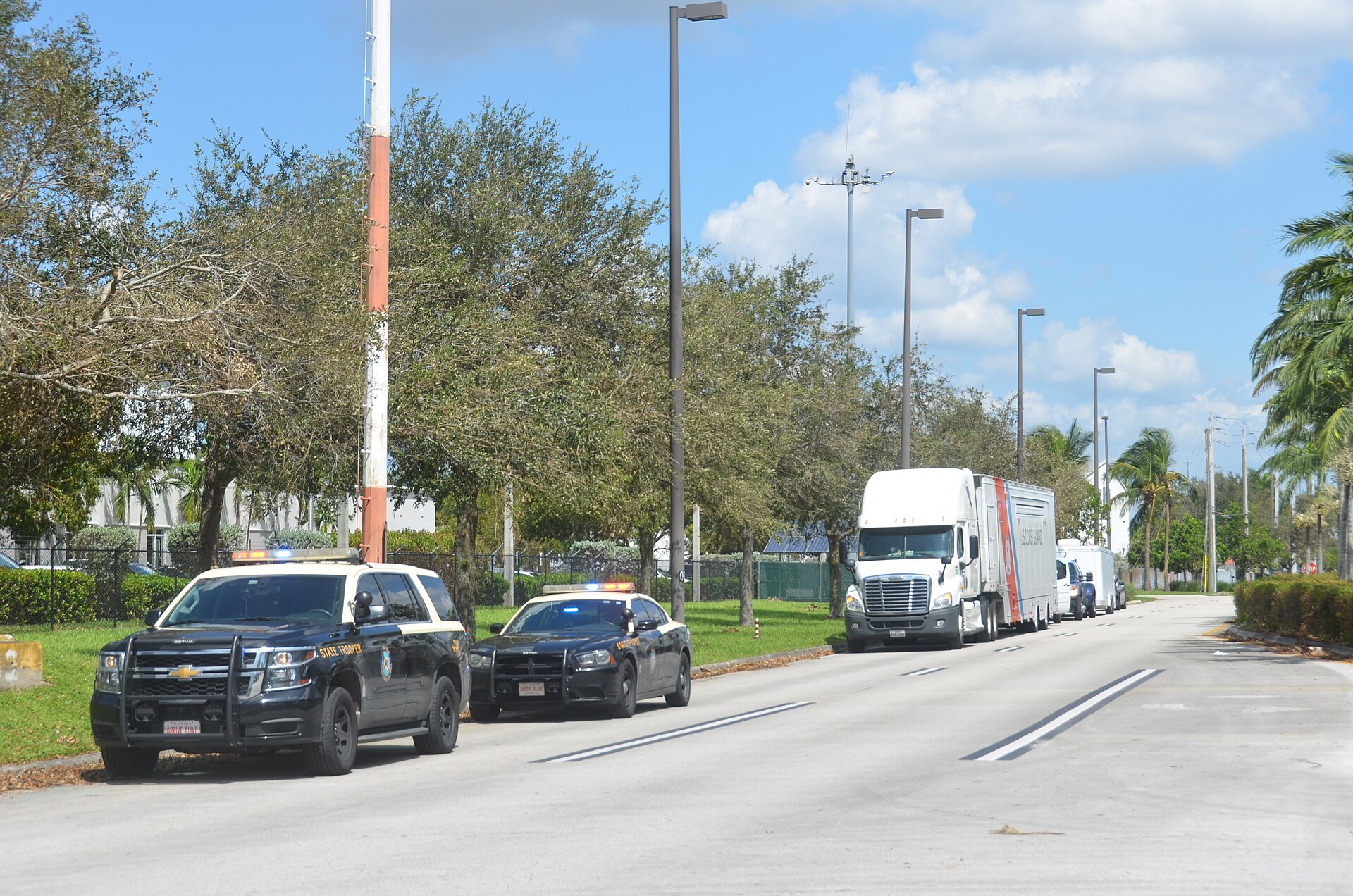 Freight trucks lined up at a cross-border facility, representing M&A targets in nearshoring and cross-border logistics