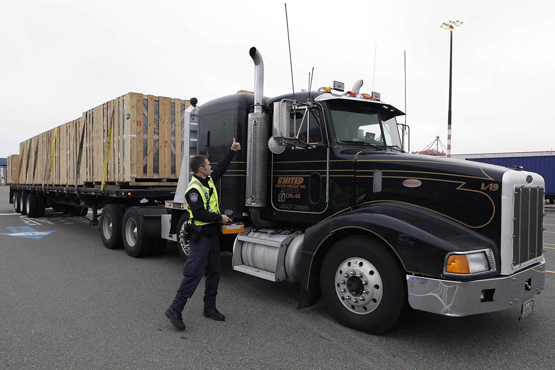 Commercial trucks lined up at U.S.-Mexico border crossing waiting for customs clearance