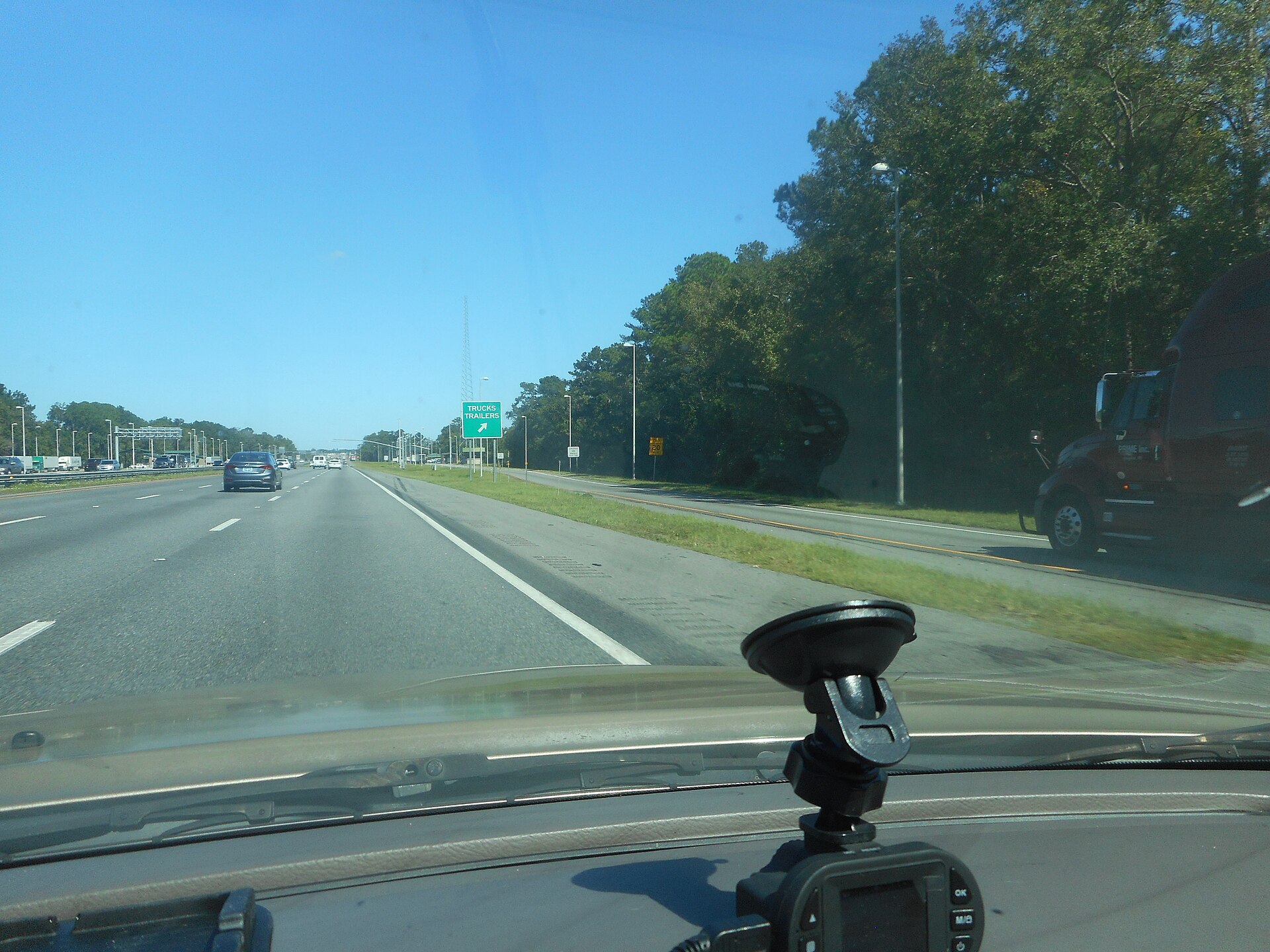 Semi-truck on highway representing motor carriers subject to FMCSA registration and enforcement oversight