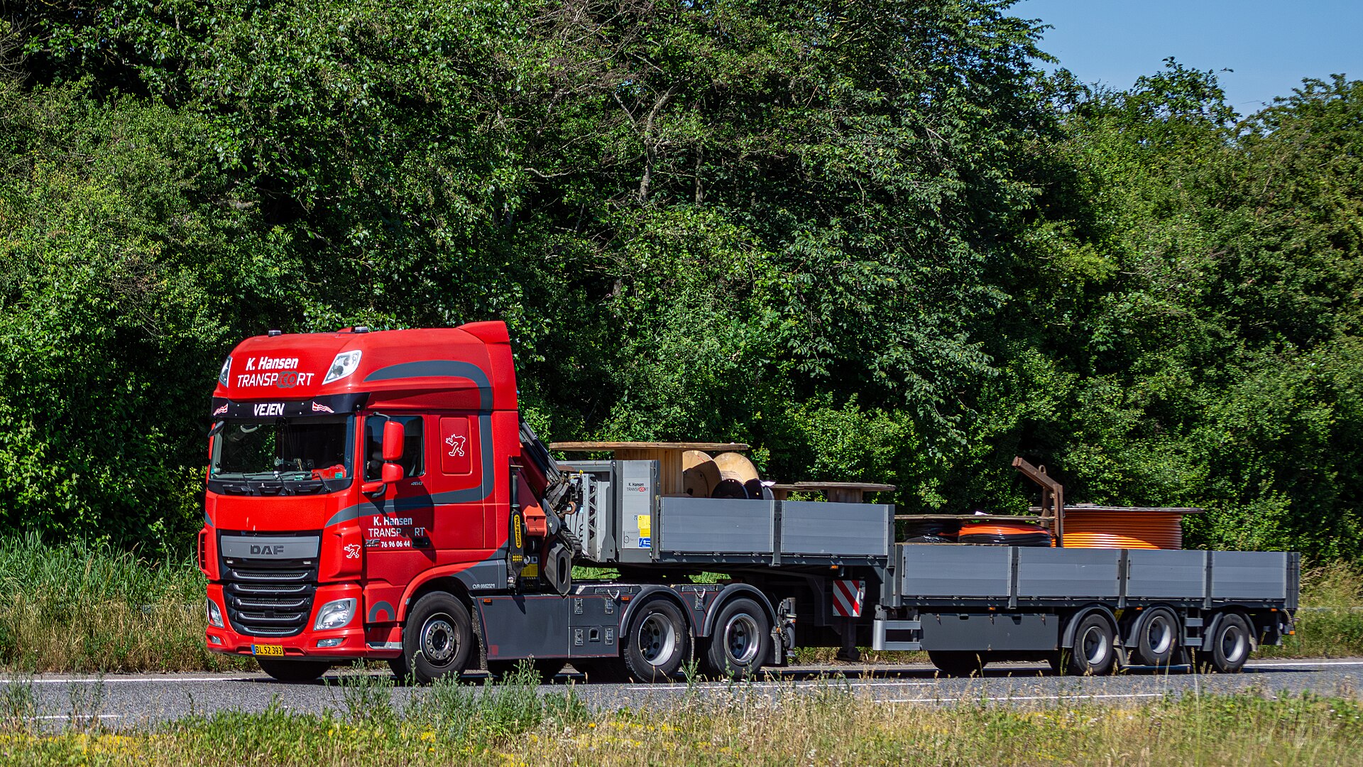 Commercial truck being inspected by law enforcement officer during roadside safety campaign