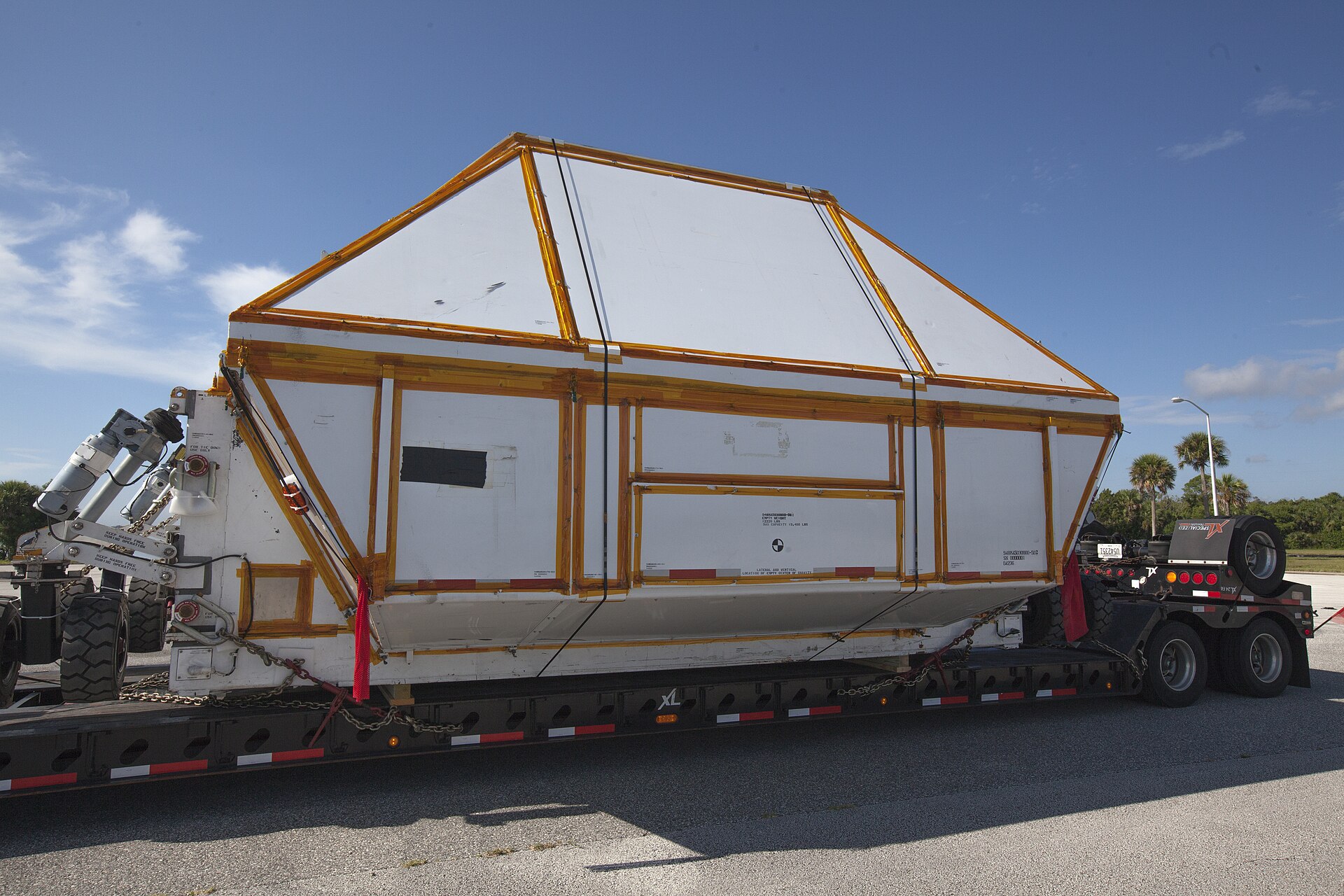 Rows of new dry van trailers parked at a manufacturing facility awaiting delivery to fleets
