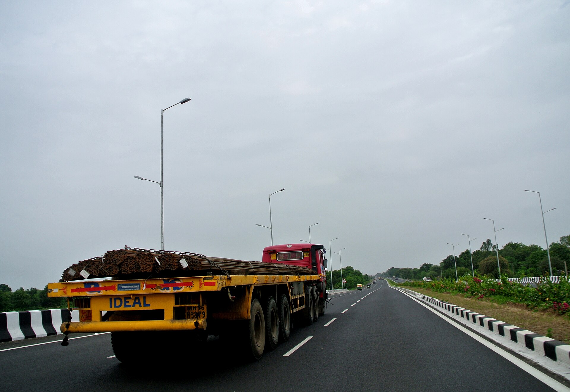 Truck hauling freight on highway, representing tonnage volume tracked by ATA index