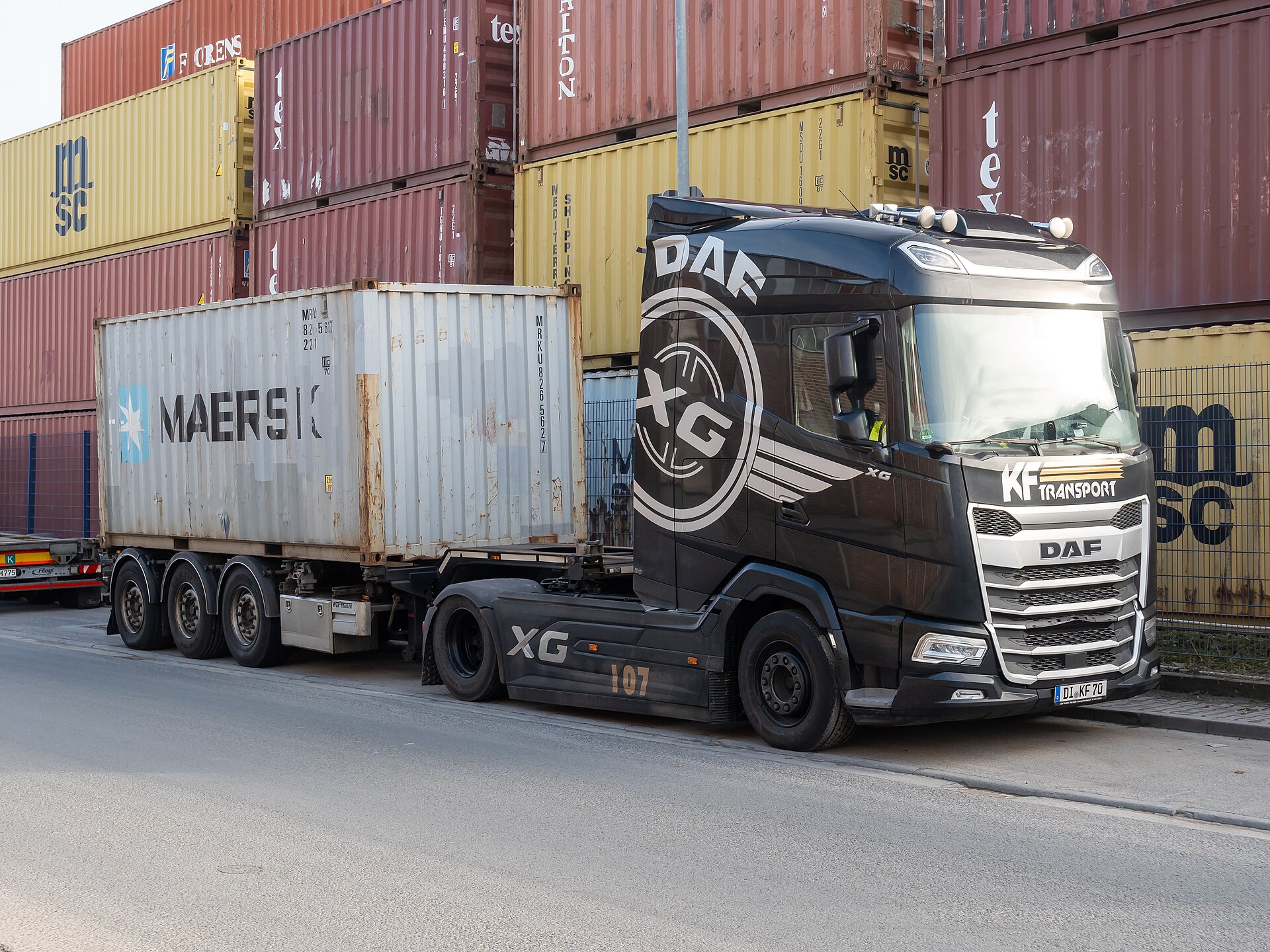 Refrigerated trailer at warehouse dock with temperature monitoring equipment visible